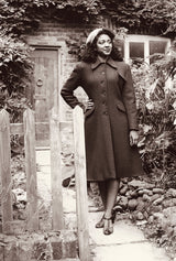 Autumn Collection 'A Window in Time' Hero image, from our photoshoot at a rustic old cottage. Featuring our new 1930s/40s Princess Coat in Red Ruby Wool. Black and White Image that is inspired by authentic autumnal 1940s Photographs.