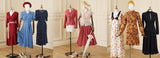 A row of vintage clothing mannequins in a bright room, displaying various dresses and coordinated outfits. The collection includes a red wrap dress, a blue button-up dress, a navy polka-dot dress, a coral cardigan with a pink skirt, 
