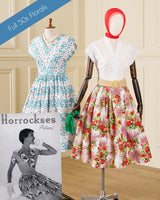 Two vintage-style dress patterns displayed on mannequins in an indoor room setting. One mannequin wears a white dress with blue and green floral print, and the other wears a white blouse with a pink floral skirt.