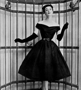 woman in dress in black and white photograph